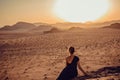 Outdoor Adventure. Sunset desert. Traveler explore world. Woman journey. Freedom travel. Luxury holidays. Active lifestyle. Royalty Free Stock Photo