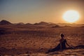 Outdoor Adventure. Sunset desert. Traveler explore world. Woman journey. Freedom travel. Luxury holidays. Harmony concept. Copy Royalty Free Stock Photo