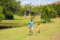 Outdoor adventures of daddy and son fatherhood together. football family team of father and son. happy childhood