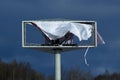 Outdoor advertising banner torn by the wind