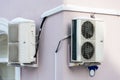 An outdoor air conditioner unit consisting of two fans. A large industrial air conditioner on the wall of a store or enterprise. Royalty Free Stock Photo