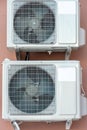 An outdoor air conditioner unit consisting of two fans. A large industrial air conditioner on the wall of a store or enterprise. Royalty Free Stock Photo