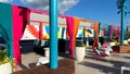 The outdoor amenities with a swimming pool, cabanas and lounge chairs at the Wave Hotel at Lake Nona in Orlando, Florida