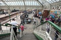 Outdoor antiques flea market held in railway station showing vendor social distancing