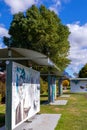 Permanent ongoing outdoor art exhibition - like bus shelters where the art is the focus