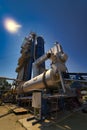 Outdoor asphalt mixes station. Loading equipment. Asphalt mixture. Selective focus. Royalty Free Stock Photo