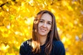 Outdoor atmospheric fashion photo of a young beautiful lady in the autumn landscape. Autumn in the Park Royalty Free Stock Photo