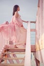 Beautiful pregnant woman on the lifeguard tower