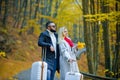 Outdoor autumn portrait of young beautiful fashionable couple. Man and woman wearing stylish autumn clothes and Royalty Free Stock Photo