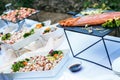 Outdoor banquet table with many snacks and delicacies Royalty Free Stock Photo