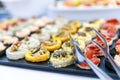 Outdoor banquet table with many snacks and delicacies Royalty Free Stock Photo