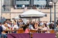 An outdoor bar in Canary Wharf packed with people drinking Royalty Free Stock Photo