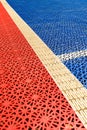 Outdoor basketball court plastic flooring tile detail Royalty Free Stock Photo