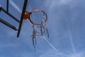 Outdoor Basketball Hoop Close Up with Clouds and Blue Sky Royalty Free Stock Photo