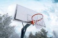 Outdoor basketball hoop covered by hoarfrost