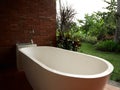 outdoor bathroom brick wall Exotic privacy with nature green garden Royalty Free Stock Photo