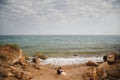 Outdoor beach wedding ceremony, stylish wedding loving couple is sitting near the sea