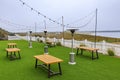 Outdoor beachfront restaurant in Half Moon Bay in the Bay Area with the Pacific Ocean in the background on a foggy day