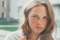 Outdoor beauty. Portrait of smiling young and happy woman with freckles. Royalty Free Stock Photo