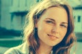 Outdoor beauty. Portrait of smiling young and happy woman with freckles. Royalty Free Stock Photo