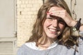 Outdoor beauty. Portrait of smiling young and happy woman with freckles. Royalty Free Stock Photo