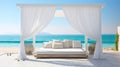 Outdoor bed in front of the ocean with white curtains Royalty Free Stock Photo