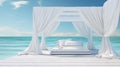 Outdoor bed in front of the ocean with white curtains Royalty Free Stock Photo
