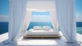 Outdoor bed in front of the ocean with white curtains Royalty Free Stock Photo