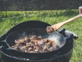 Outdoor beef goulash - traditional beef stew in dutch oven