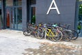 Outdoor bicycle parking near the entrance to the new modern residential building. Royalty Free Stock Photo