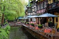 Outdoor bistro waterside in Swiss themed area at spring