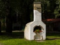 Outdoor bread oven with flowers in a park