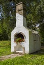 Outdoor bread oven with flowers in a park