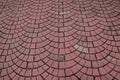 Outdoor brick like Pavement laid as repeated semicircle pattern