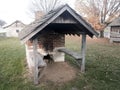 Outdoor brick oven with wooden shingled shelter Royalty Free Stock Photo