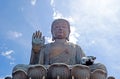 Outdoor bronze statue of seated Tian Tan Buddha in Hong Kong Royalty Free Stock Photo