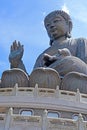 Outdoor bronze statue of seated Tian Tan Buddha in Hong Kong Royalty Free Stock Photo