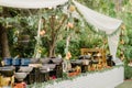 Outdoor buffet featuring a variety of vibrant colored dishes set up at an outdoor event venue Royalty Free Stock Photo