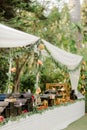 Outdoor buffet featuring a variety of vibrant colored dishes set up at an outdoor event venue Royalty Free Stock Photo