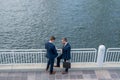 Outdoor business meeting. Photo of business partners talk conversation outdoor. Two handsome businessmen in suits Royalty Free Stock Photo