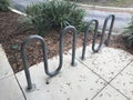 7 Loop wave Bike Rack in sidewalk. Photo image