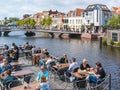 Outdoor cafe and bridge over Rhine canal, Leiden, Netherlands