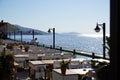 Outdoor cafe with a chic view of the bay, Seaside wooden table and chairs open cafe outdoor restaurant in Marina Bay