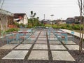 a collection of tables and chairs in the courtyard of a cafe