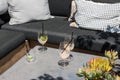 Outdoor cafe couch, empty drink glasses Royalty Free Stock Photo