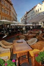 Outdoor cafe in Prague on a deserted street tables . Old street in Old Town of Prague. Czech Republic, Central Eastern Europe. Royalty Free Stock Photo