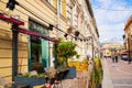 Outdoor cafe on street, sidewalk restaurant of Georgian cuisine. Cafe summer terrace. Text translation: khachapuri