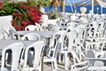 Outdoor cafe with white plastic tables and chairs Royalty Free Stock Photo
