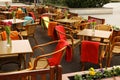 Outdoor cafe with wicker chairs and wooden tables Royalty Free Stock Photo