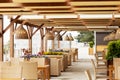 Outdoor cafe with wicker furniture and lamps. Blurred image Royalty Free Stock Photo